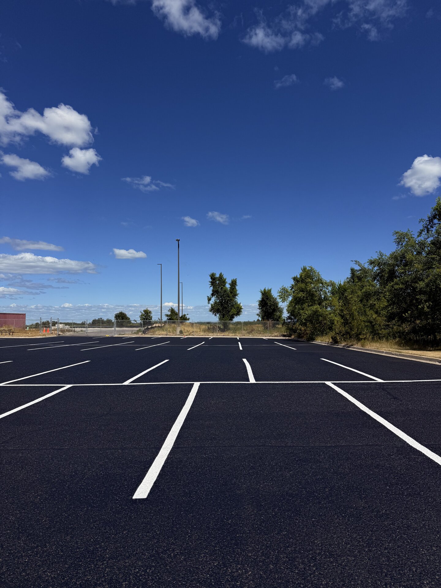 Large commercial parking lot with crisp white line painting