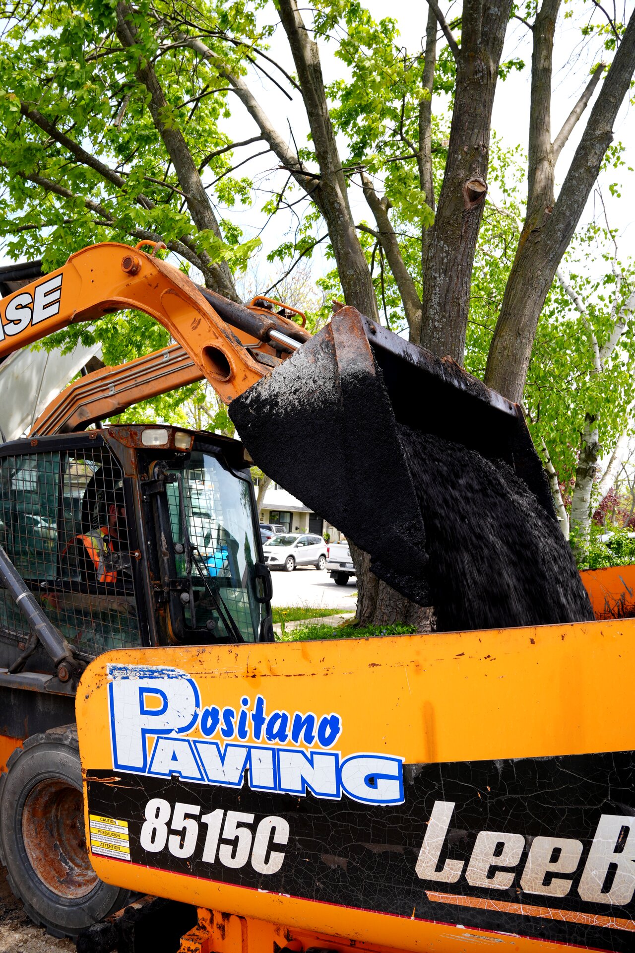 Positano Paving equipment pouring asphalt